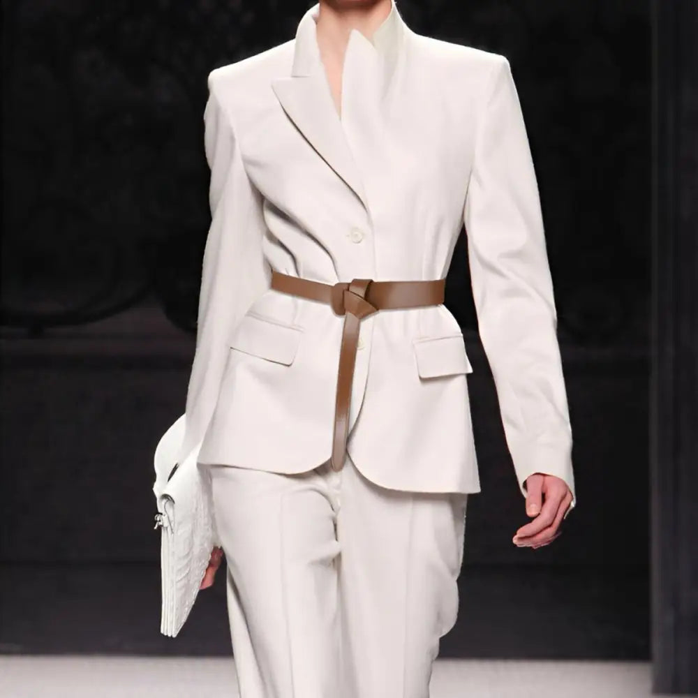 White suit with brown knotted Thiphilia Tie Belt and complementary tie belt