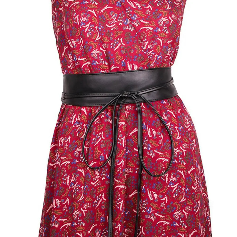 Red floral dress featuring an Isabel belt and brown leather obi front view