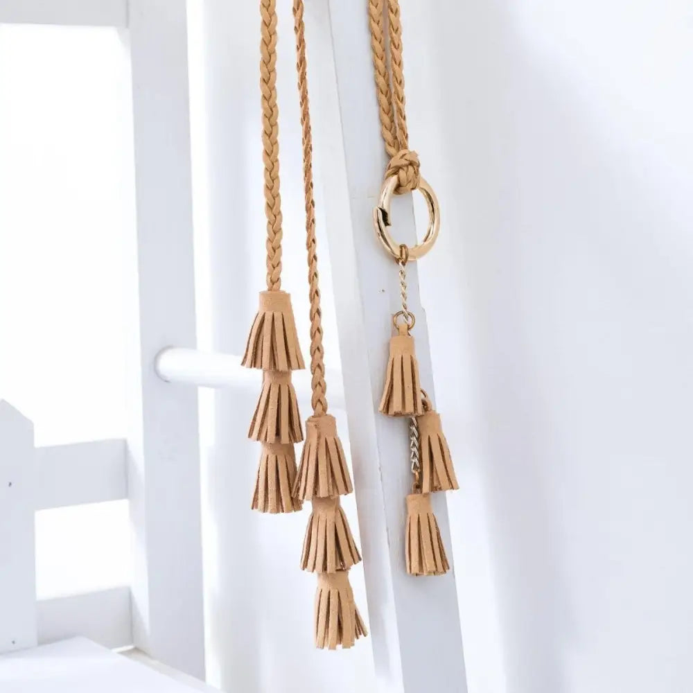 Braided tan tassel belt from Brown collection featuring stylish fringe details