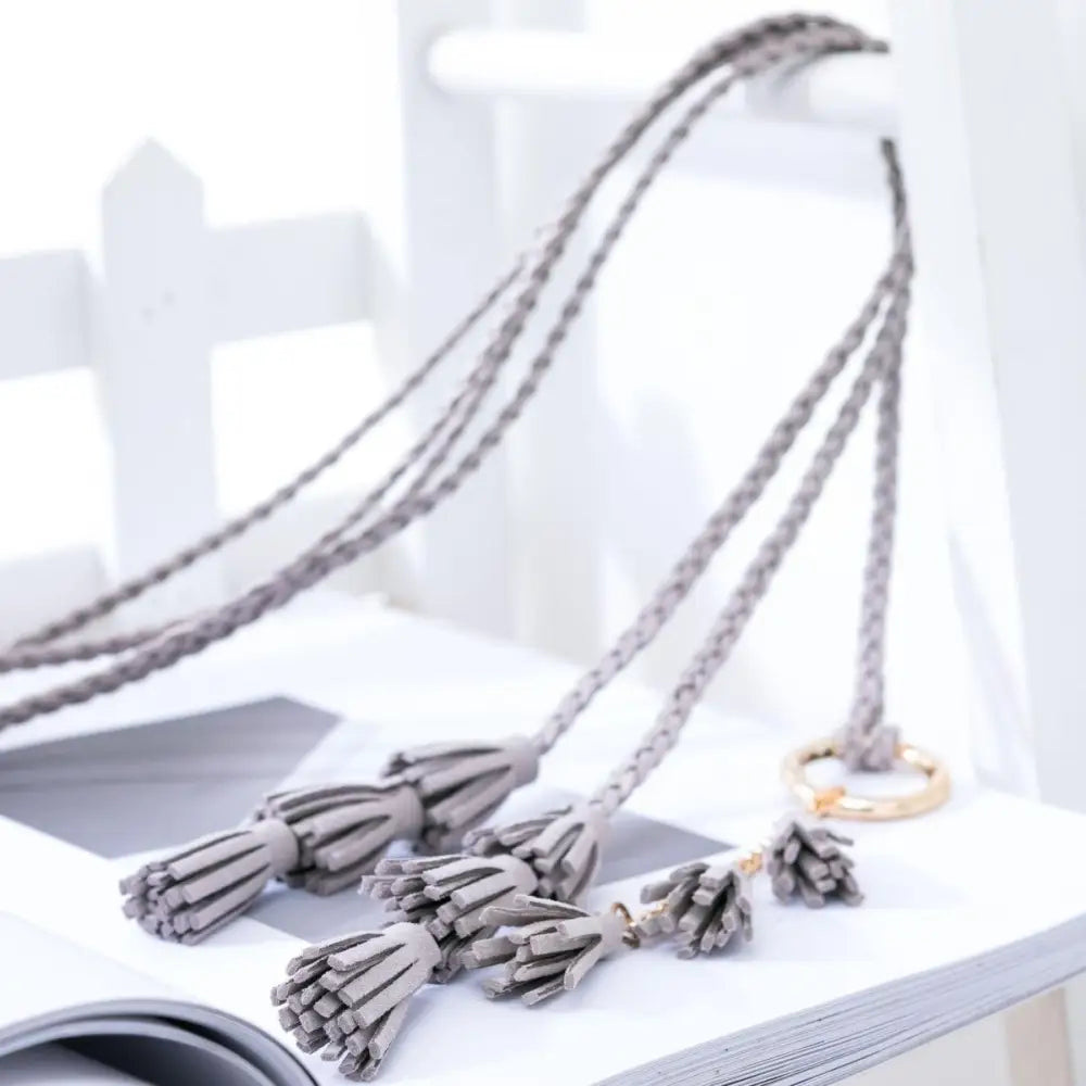 Gray braided tassel belt from Braided Tassel Necklaces and Belts in Brown