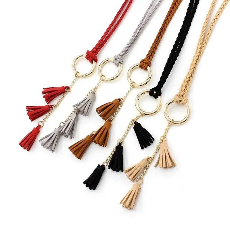 Braided tassel necklaces and belts in brown displayed for fashion accessory offering