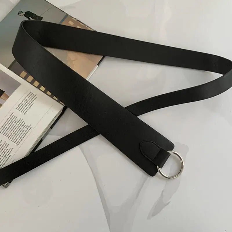 Black belt with silver ring featured in Thanusa Tie Belt for stylish formal wear