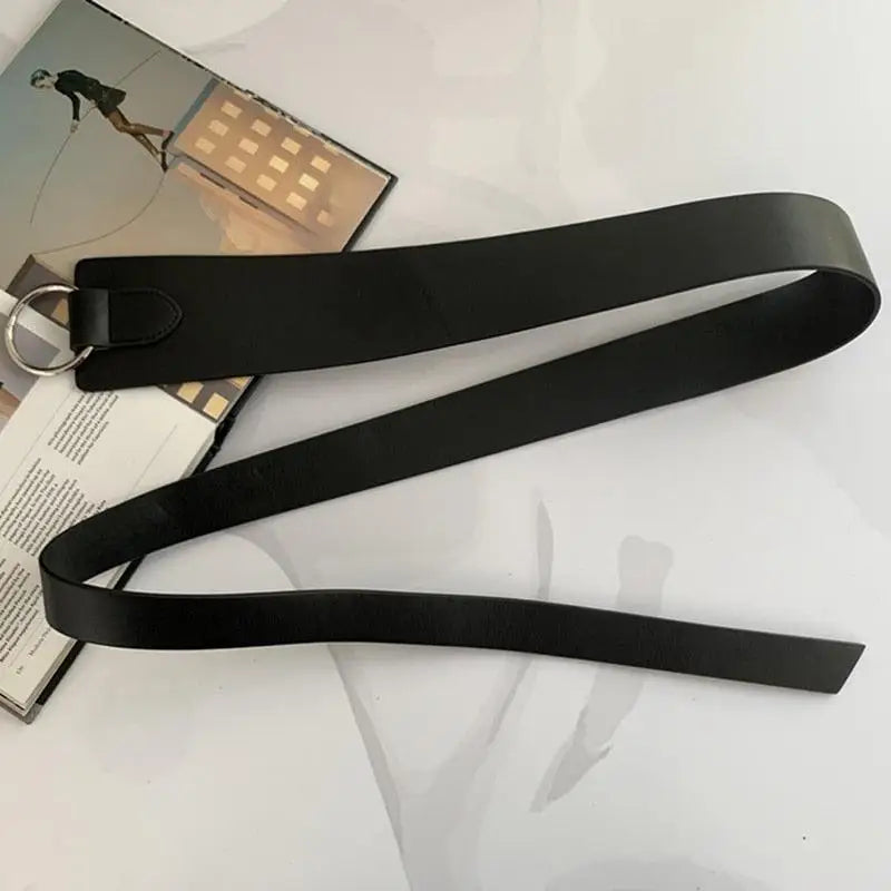Black leather tie belt with silver ring from Thanusa Tie Belt for stylish formal wear