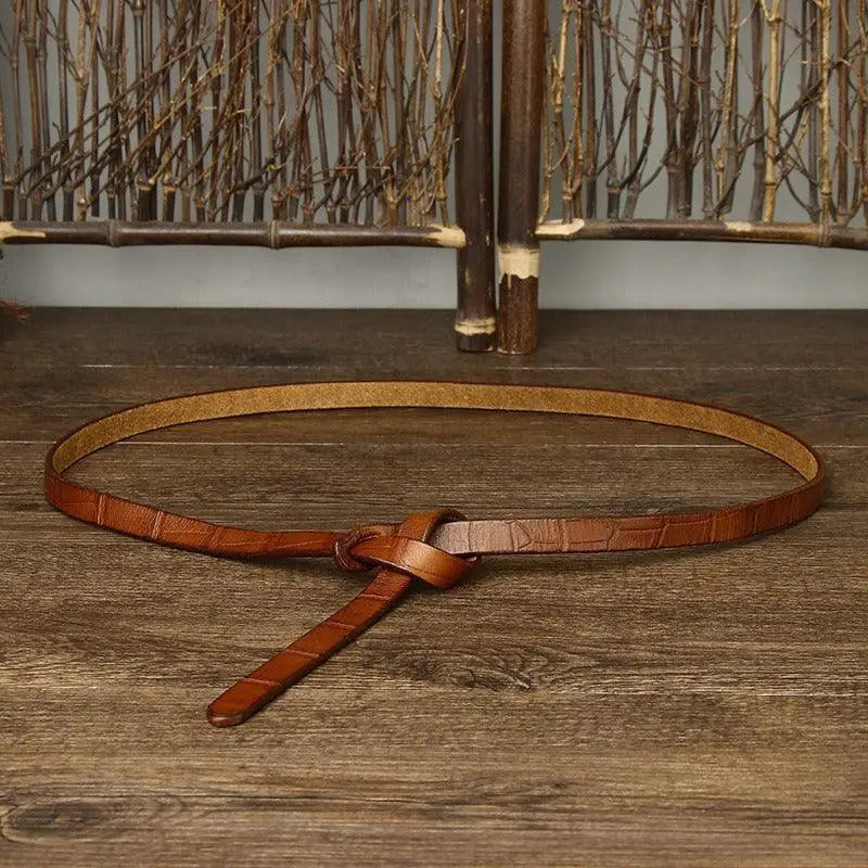 Brown leather tie belt with knot displayed; ideal for belt ubredice and accessories
