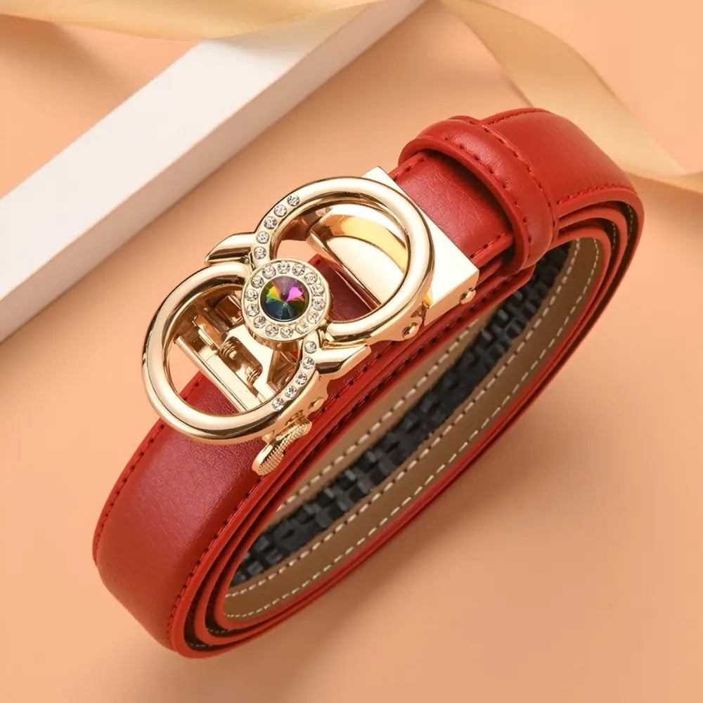 Red leather belt with a decorative gold buckle displayed in the product Red Leather Belt with Jeweled Gold Buckle
