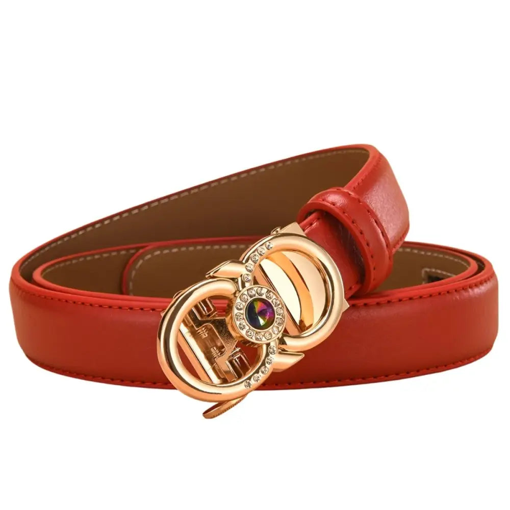 Red leather belt featuring a jeweled gold buckle for elegant fashion accessorizing