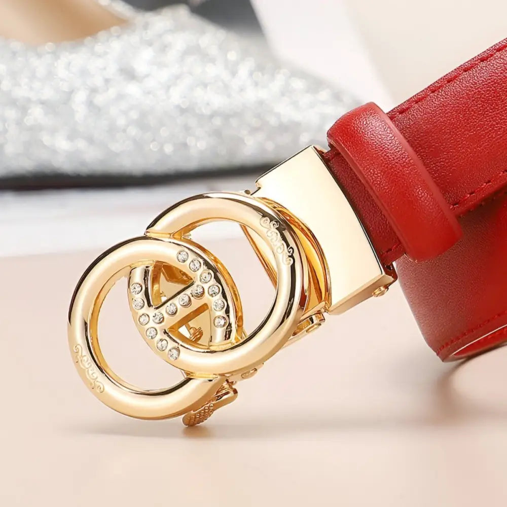 Red leather belt with gold interlocking circle buckle for elegant style and automatic leather appeal