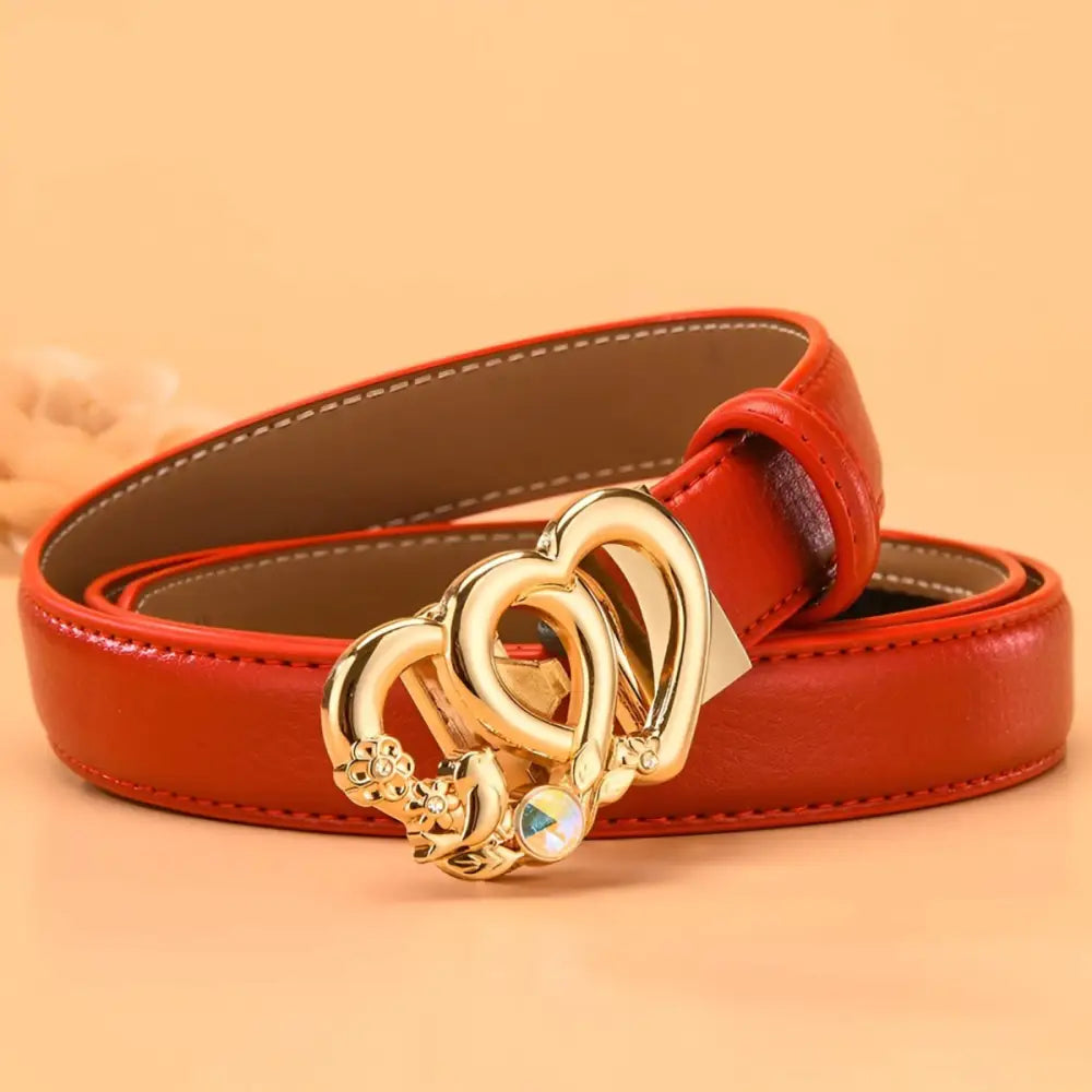 Automatic leather belt with a red leather strap and gold heart-shaped buckle