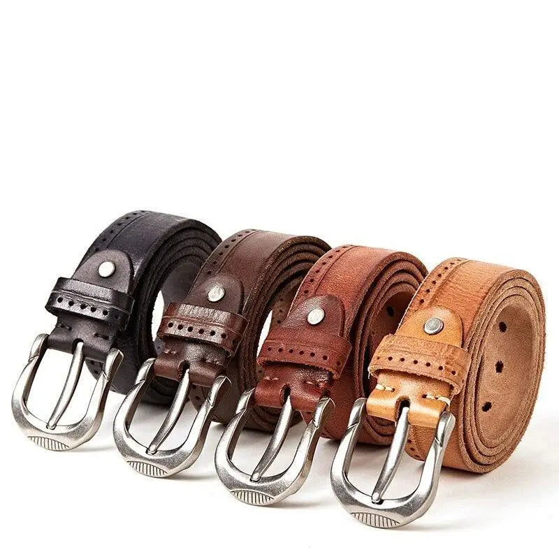 Four leather belts with silver buckles displayed alongside Ripped Blue Jeans