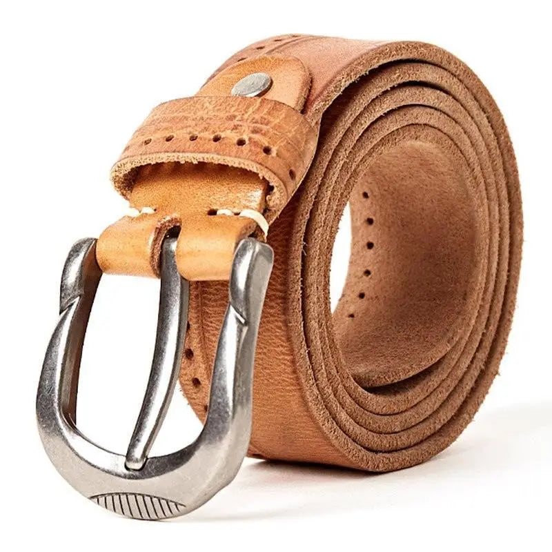 Rolled brown leather belt with silver buckle paired with ripped blue jeans