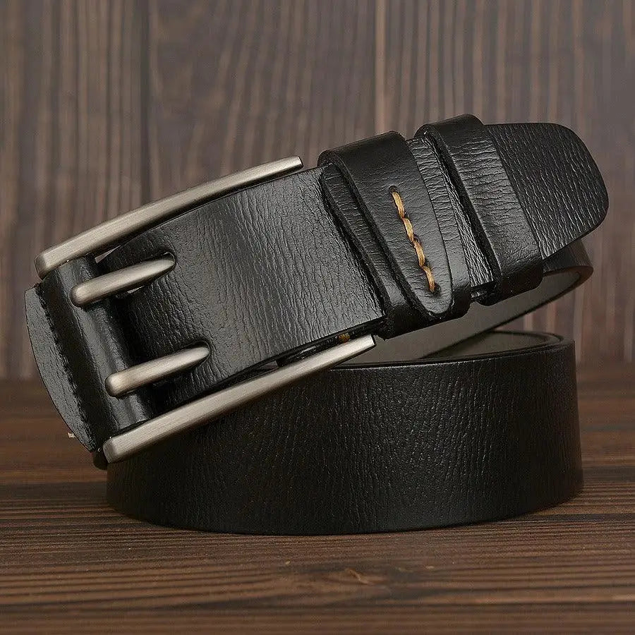 Black leather belt with a silver metal buckle displayed on a product page