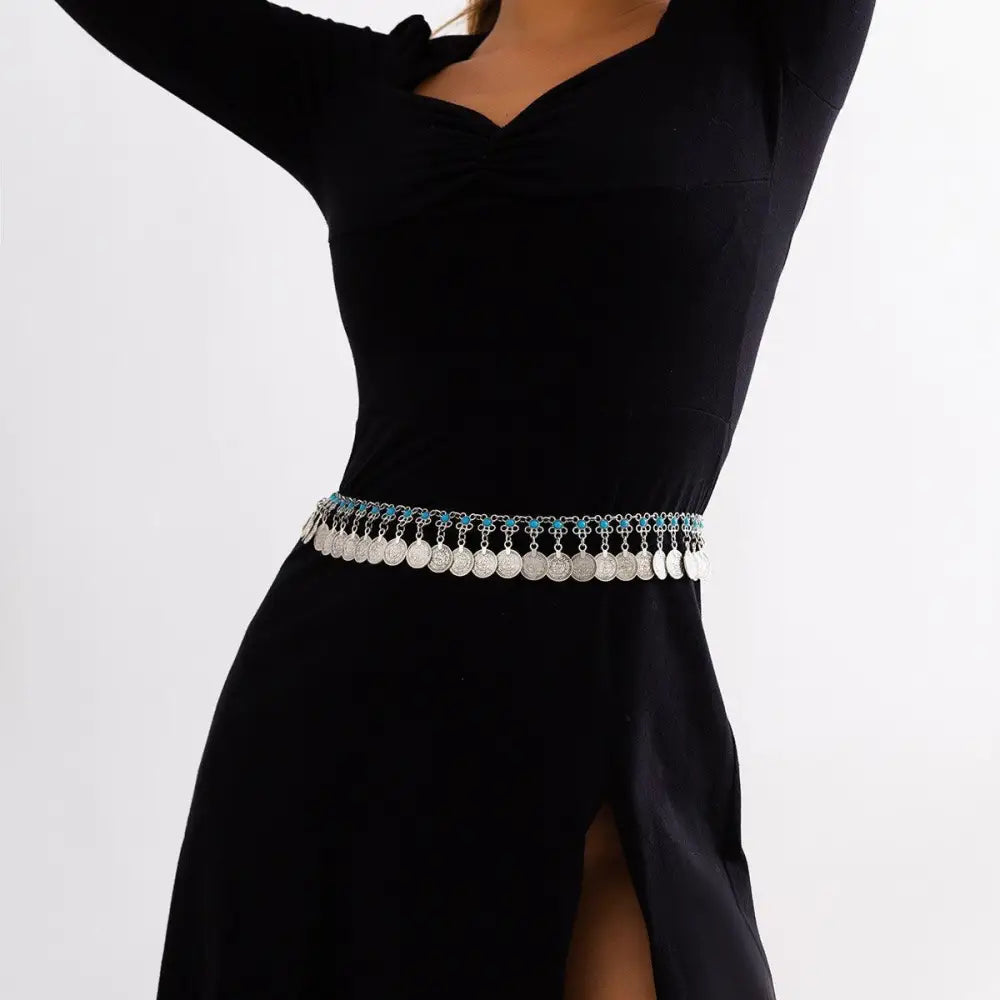 Elytie Chain Belt with silver coins and turquoise accents over a black dress