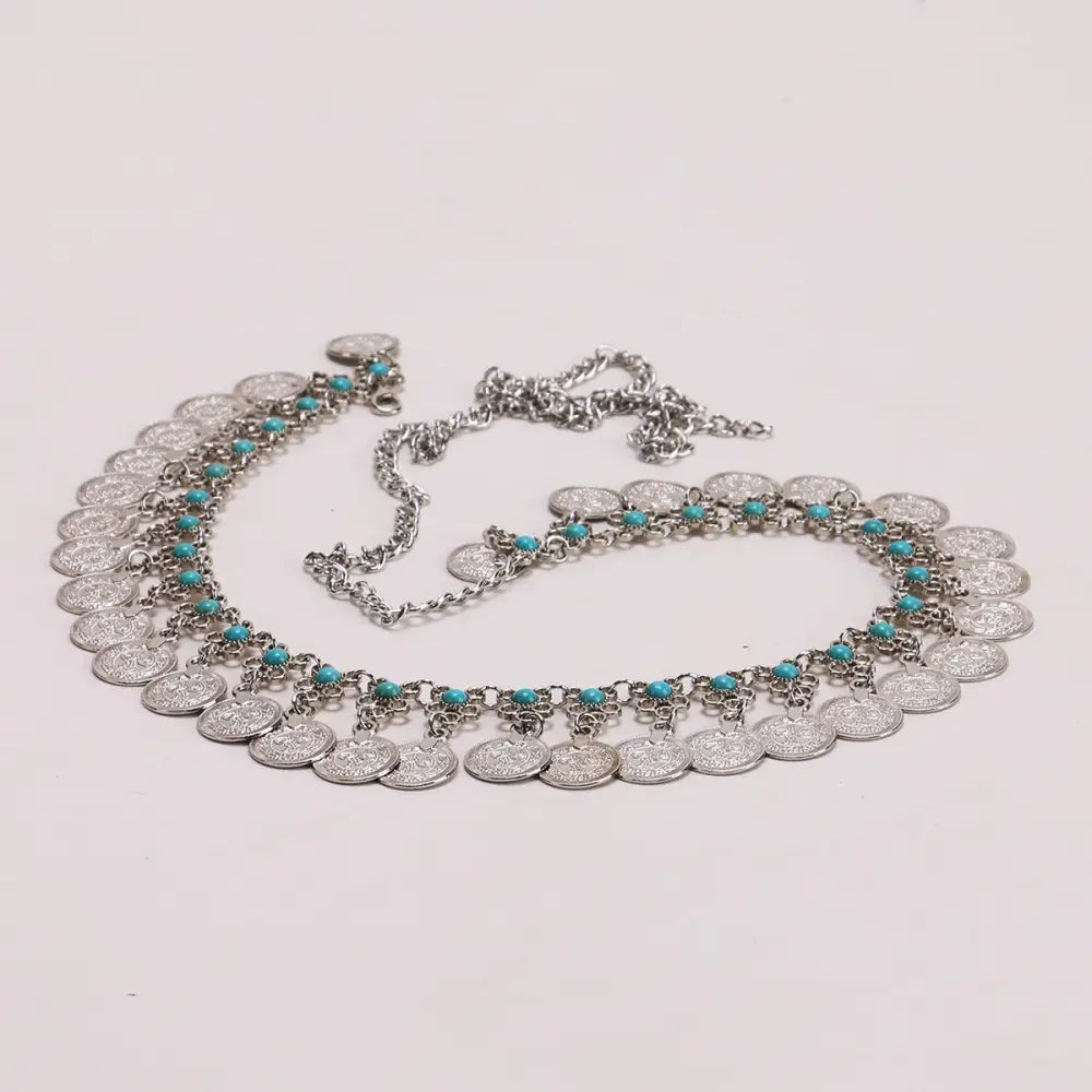 Elytie chain belt featuring silver coins and turquoise accents for an elegant look