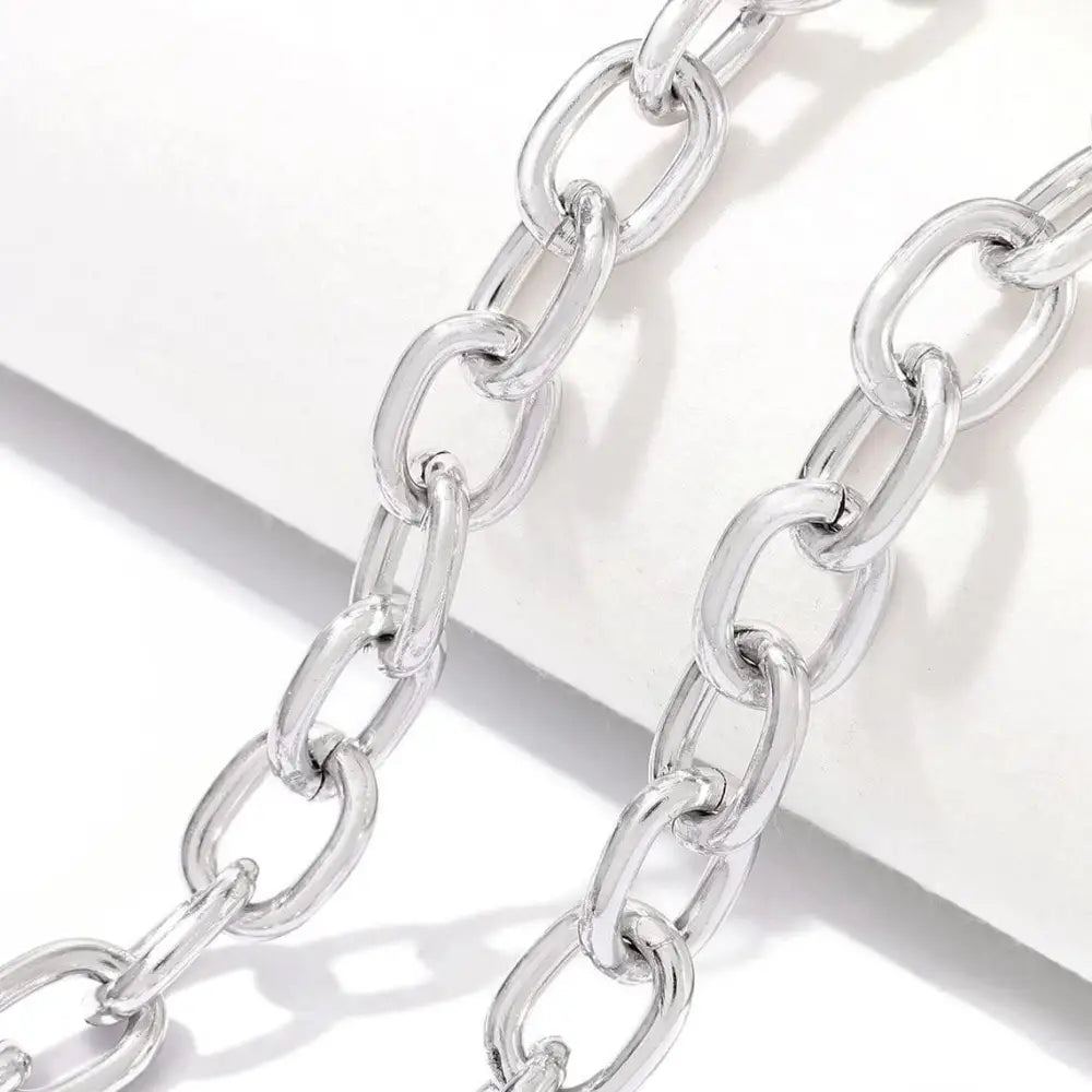 Silver metal chain links for a stylish chain belt in body jewelry with rhinestone accents