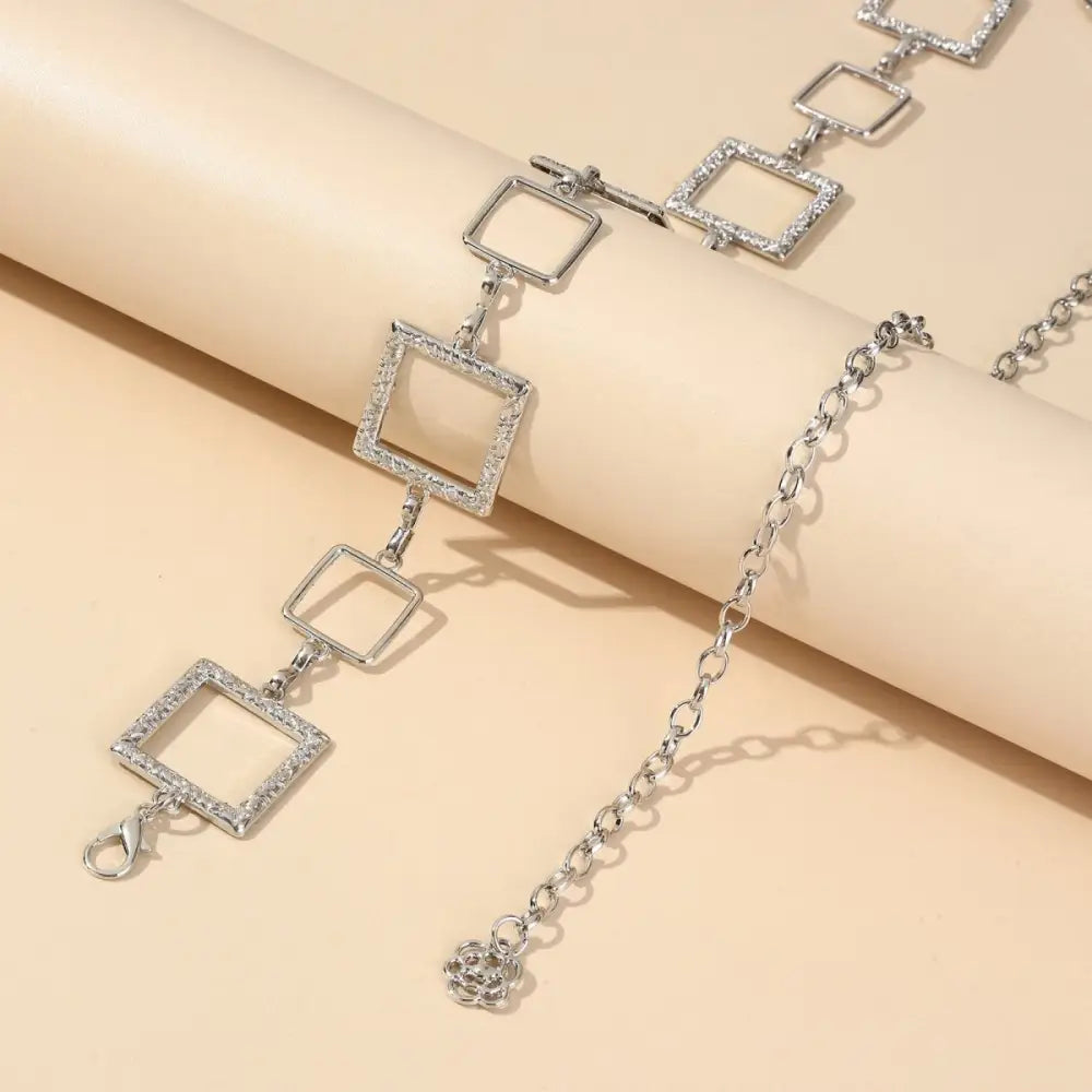 Silver-toned square-linked chain belt on Black Mini Skirt showcasing stylish belt offers
