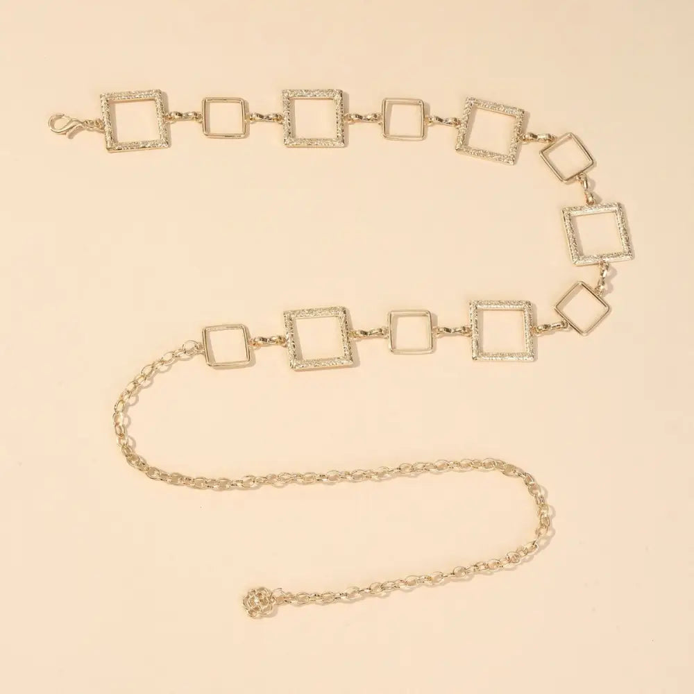 Silver square-linked chain belt on Black Mini Skirt, perfect for stylish belt offers