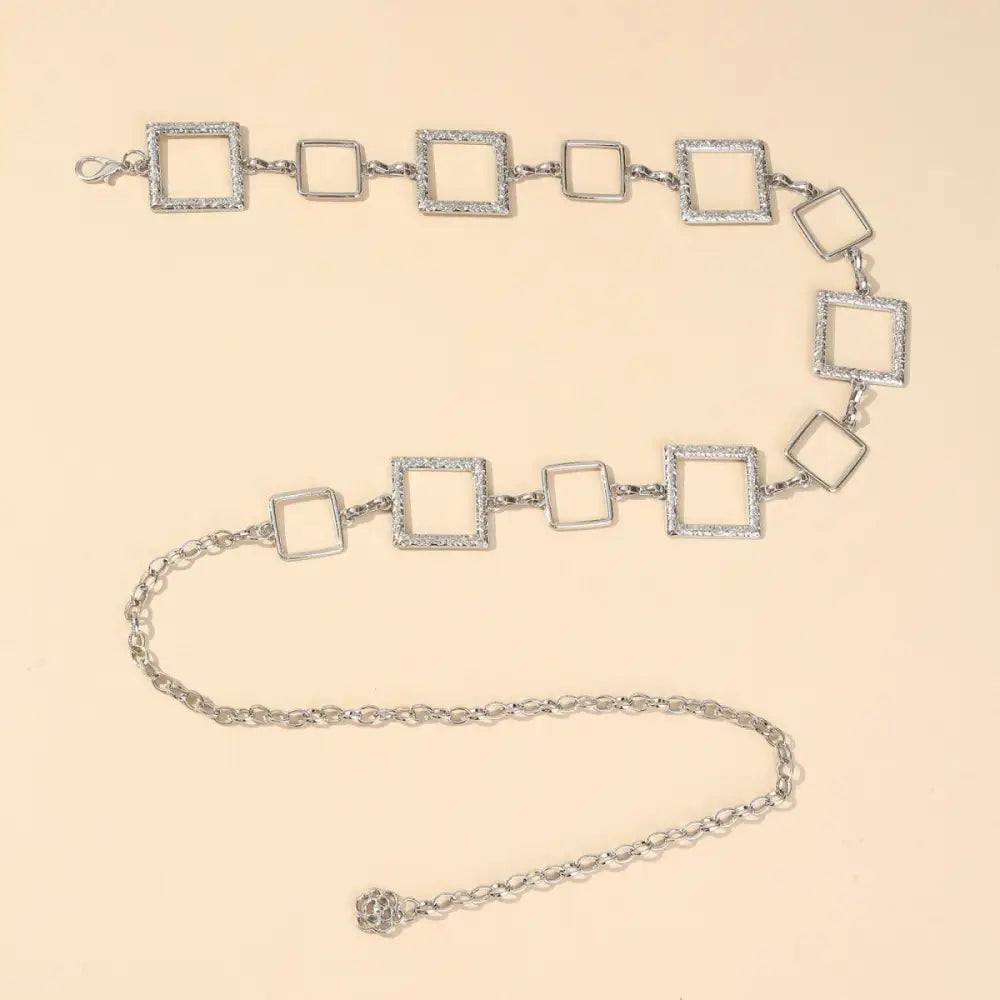Silver square-linked chain belt showcased on Black Mini Skirt with Belt Offers