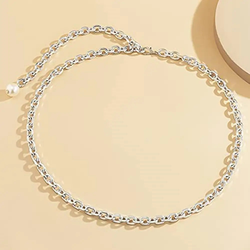 Silver chain belt with pearl accents, perfect for elegant style and fashion statements