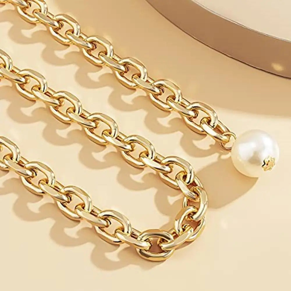 Gold chain with pearl accents on a silver and gold chain belt for elegant style
