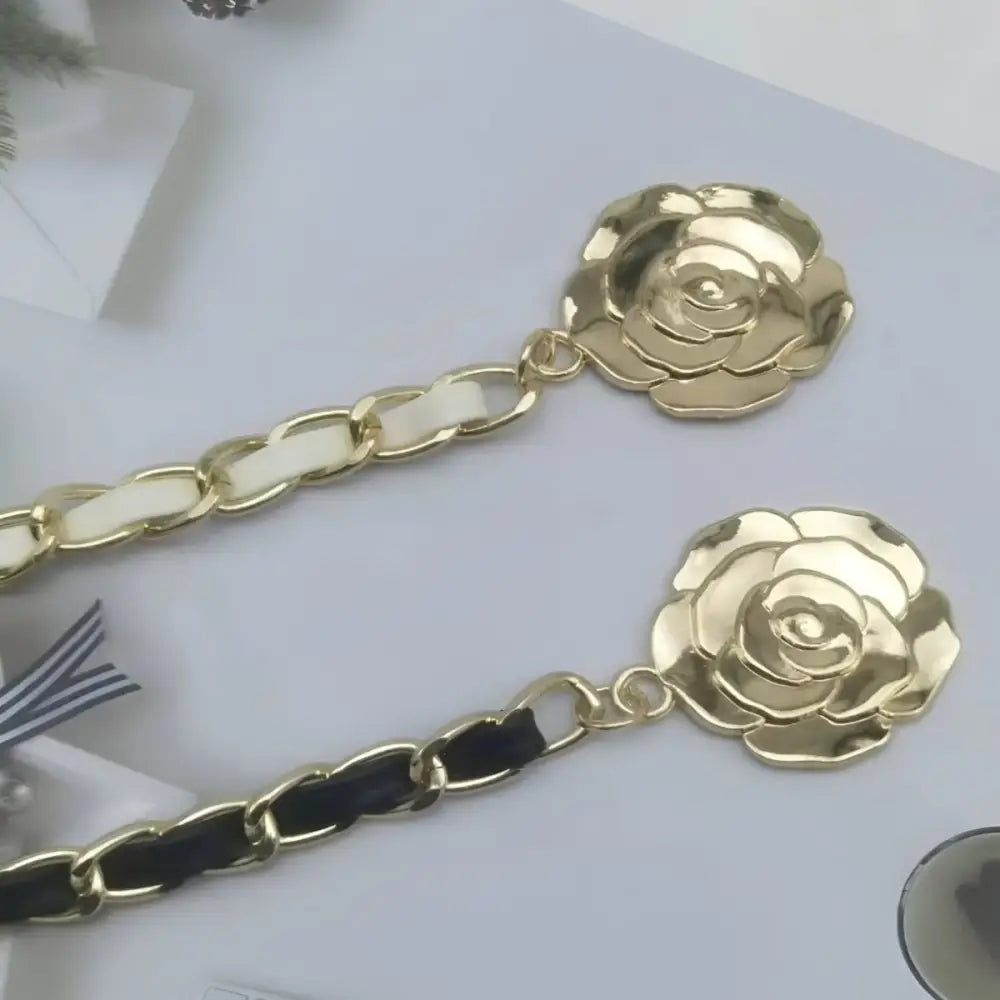 Gold rose-shaped chain belt accessory designed for black dresses