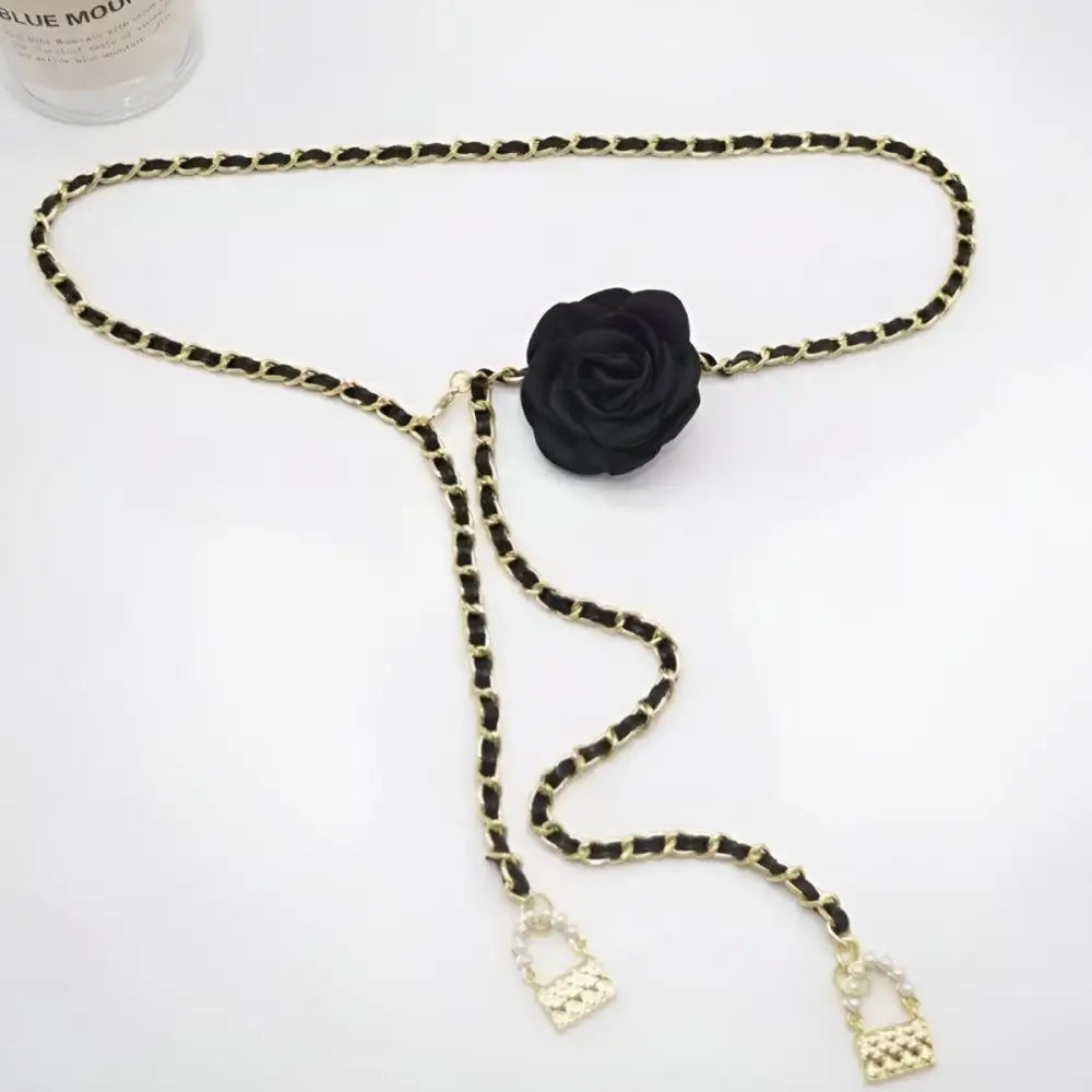 Black and gold chain belt with rose accent for Woman Black Pants featuring a chain belt
