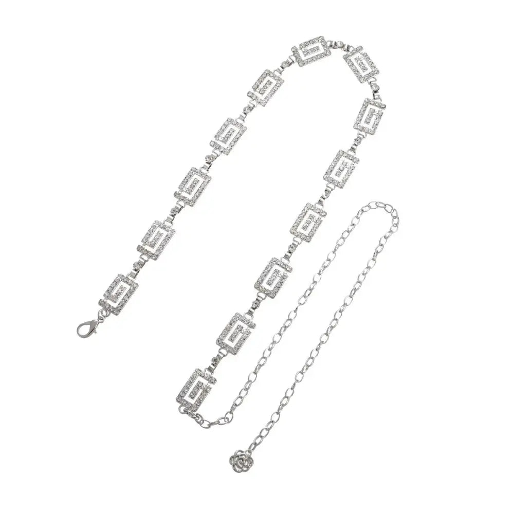 Silver rhinestone belt from Dudina Women’s chain collection with geometric and floral accents