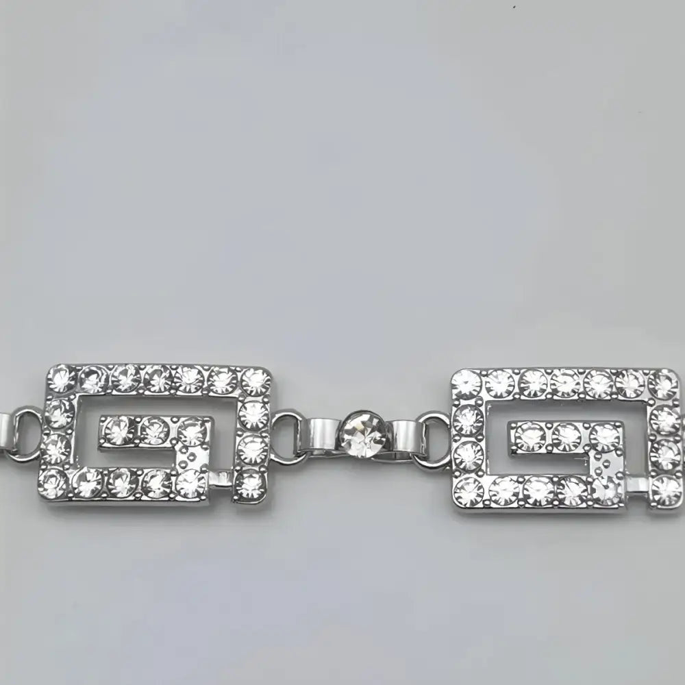 Rhinestone-studded silver bracelet from Dudina Women’s Silver Chain Belt with floral accents