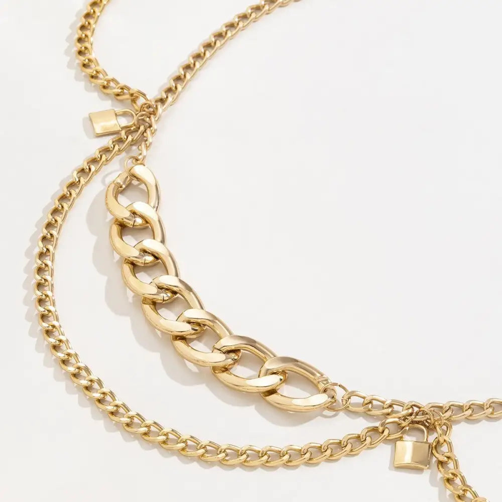 Gold-toned chain belt with padlock charms for a stylish look