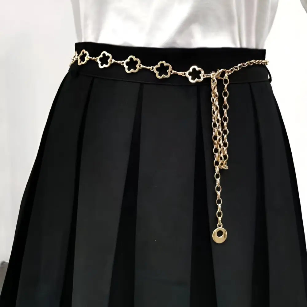Gold flower chain belt displayed with Light Blue High-Waisted Jeans