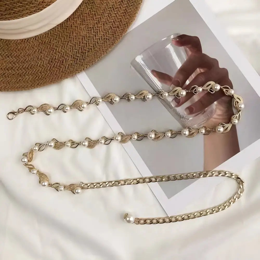 Oborina Model beige blazer with elegant pearl and gold chain belt accessory