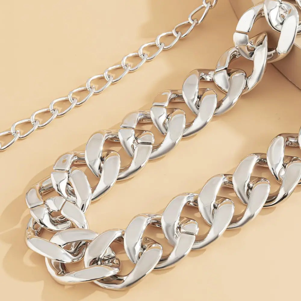 Silver-toned curb chain belt designed for stylish everyday wear and versatile fashion