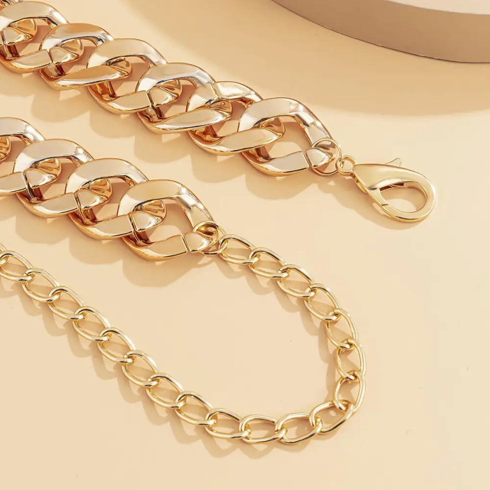 Gold-toned chain belt displayed on Silver-Toned Gold Chain Belt product for stylish wear