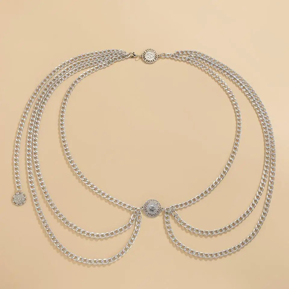Silver-toned royliope belt with decorative medallions for elegant green satin dress