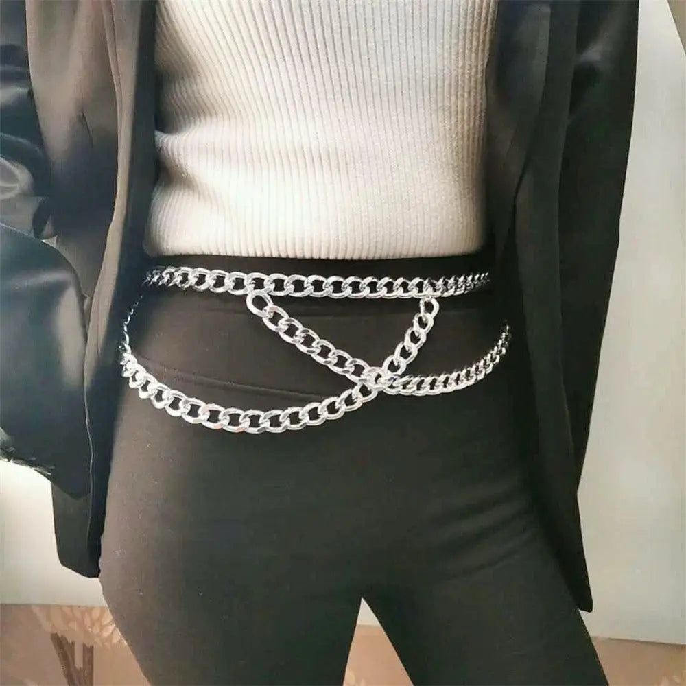 Silver chain belt accessory displayed with an olive green dress