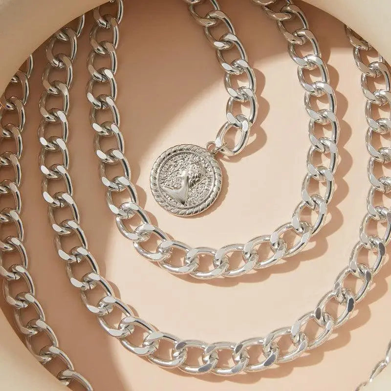 Silver-toned chain necklace featuring a coin pendant from Gold and Silver Coin Pendant Collection