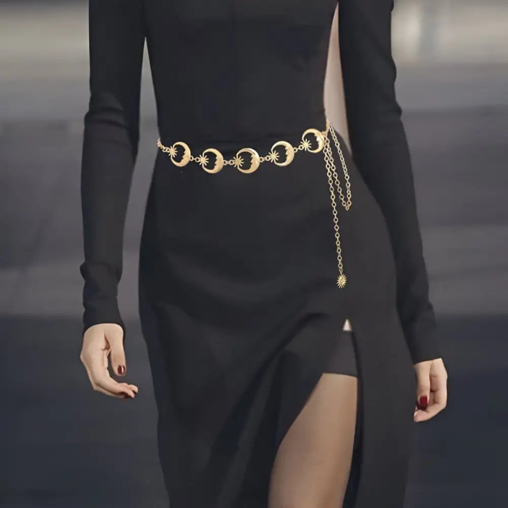 Black dress with a gold-toned Zilya chain belt featuring a moon design
