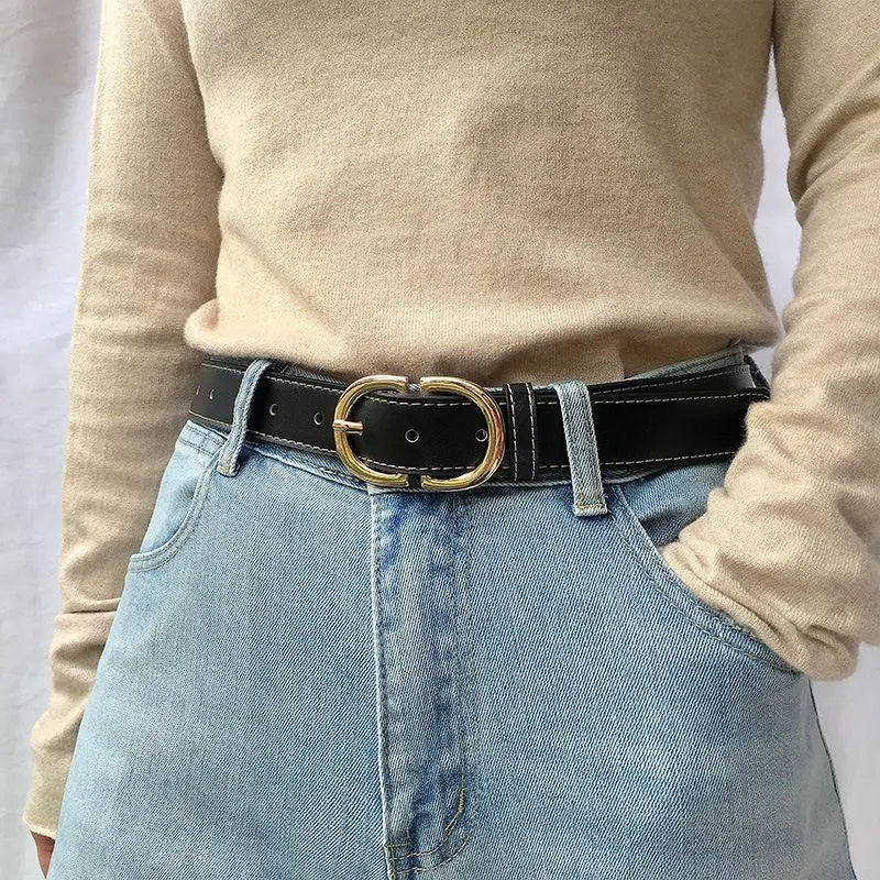Black leather belt featuring a gold buckle for a sophisticated accessory choice