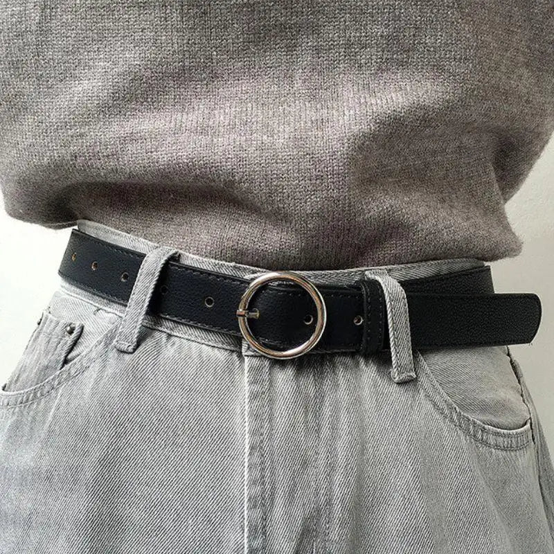 Murielle Belt Black Leather with Circular Silver Buckle showcasing a sleek black belt with circular buckle
