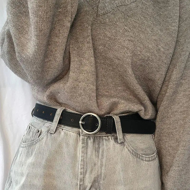 Gray jeans paired with Murielle Belt Black Leather with Circular Silver Buckle
