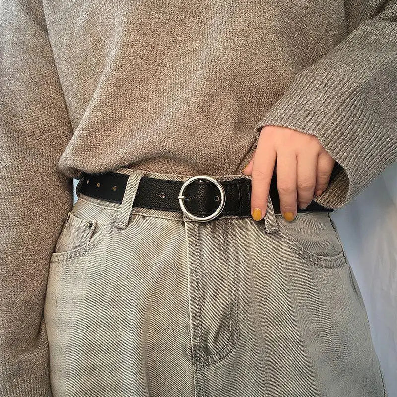 Murielle Belt Black Leather with Circular Silver Buckle showcasing a black belt with circular buckle