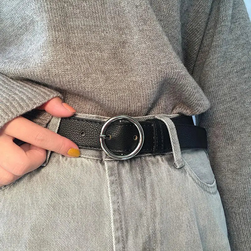 Murielle Belt Black Leather with Circular Silver Buckle showcasing a stylish black belt with silver buckle