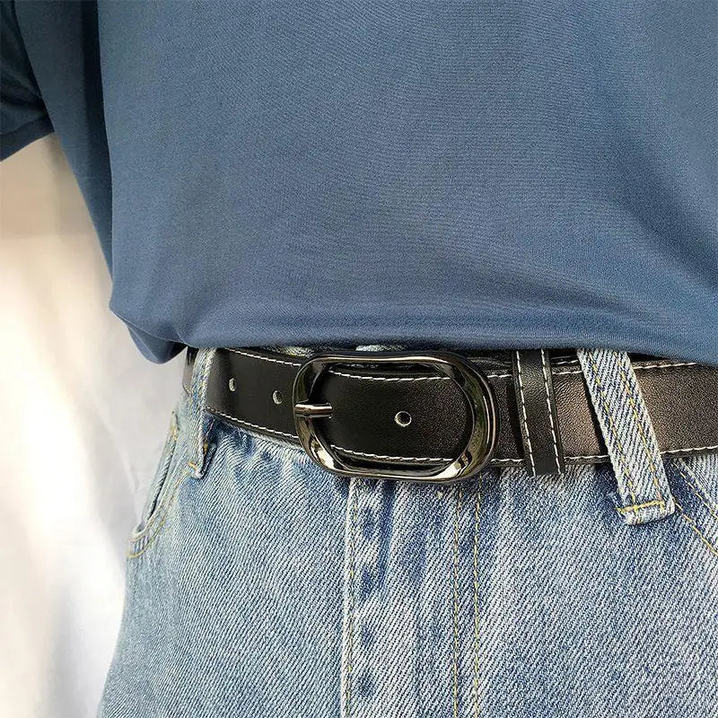 Black leather belt with a silver buckle displayed in a product image