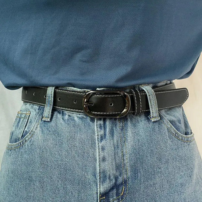 Black leather belt with white stitching and silver buckle for a stylish accessory