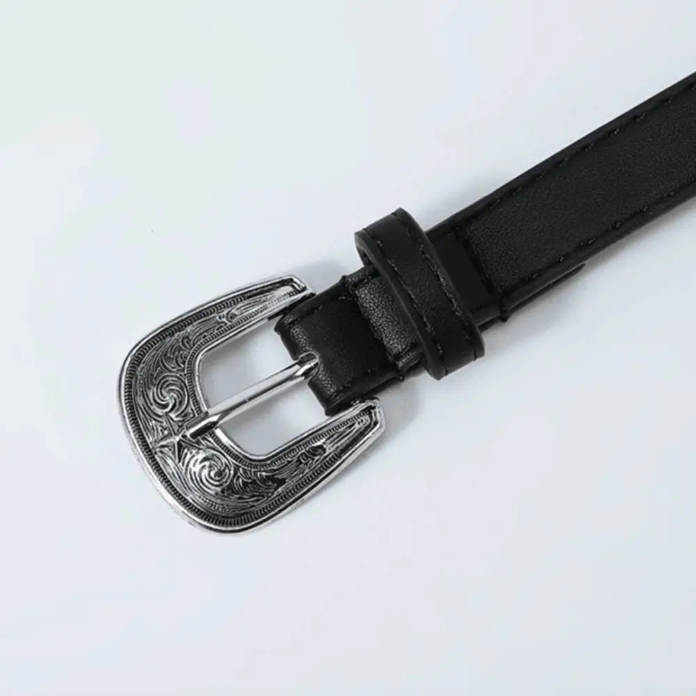 Ourahi belt featuring a black leather strap and an ornate silver buckle design
