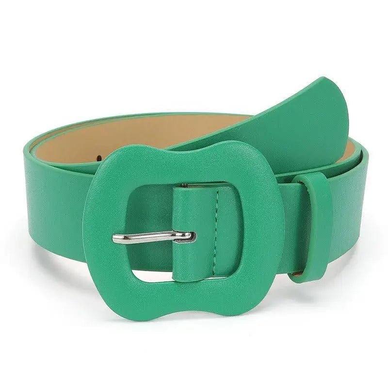 Green leather belt with an apple-shaped decorative buckle for stylish accessorizing
