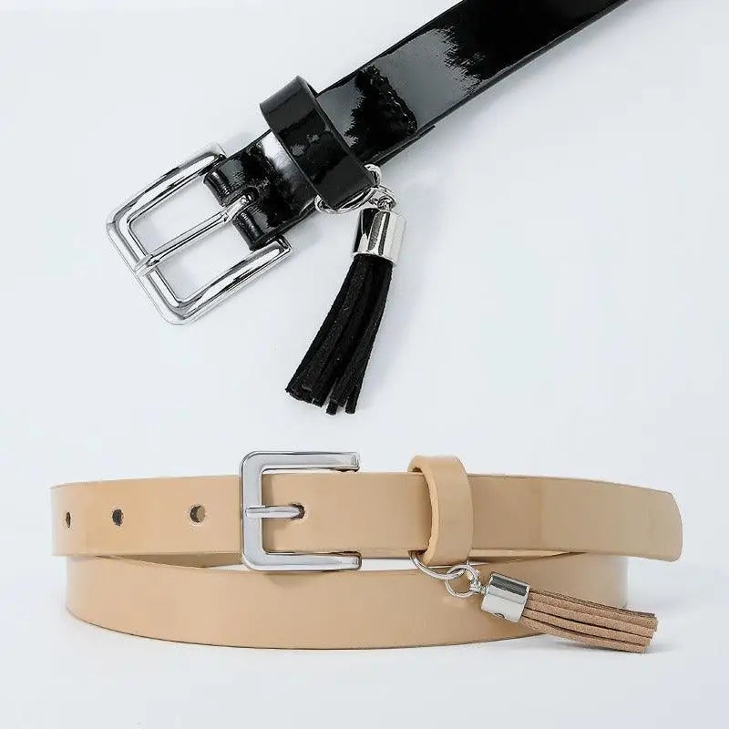 Shiny colorful women’s belt with tassels and silver buckle for fashionable accessory