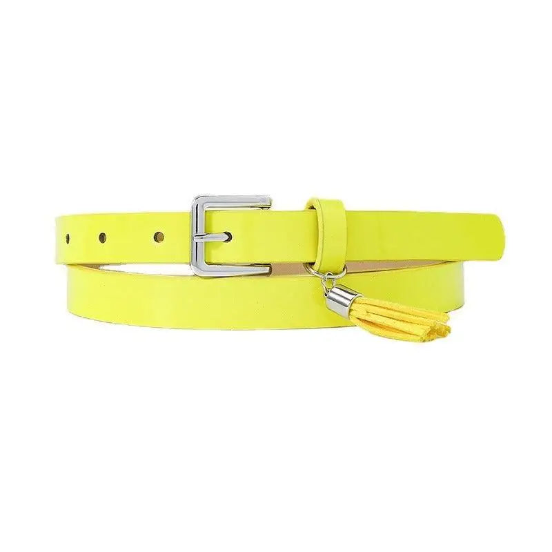 Yellow women’s belt with silver buckle and tassel in patent leather for stylish wear
