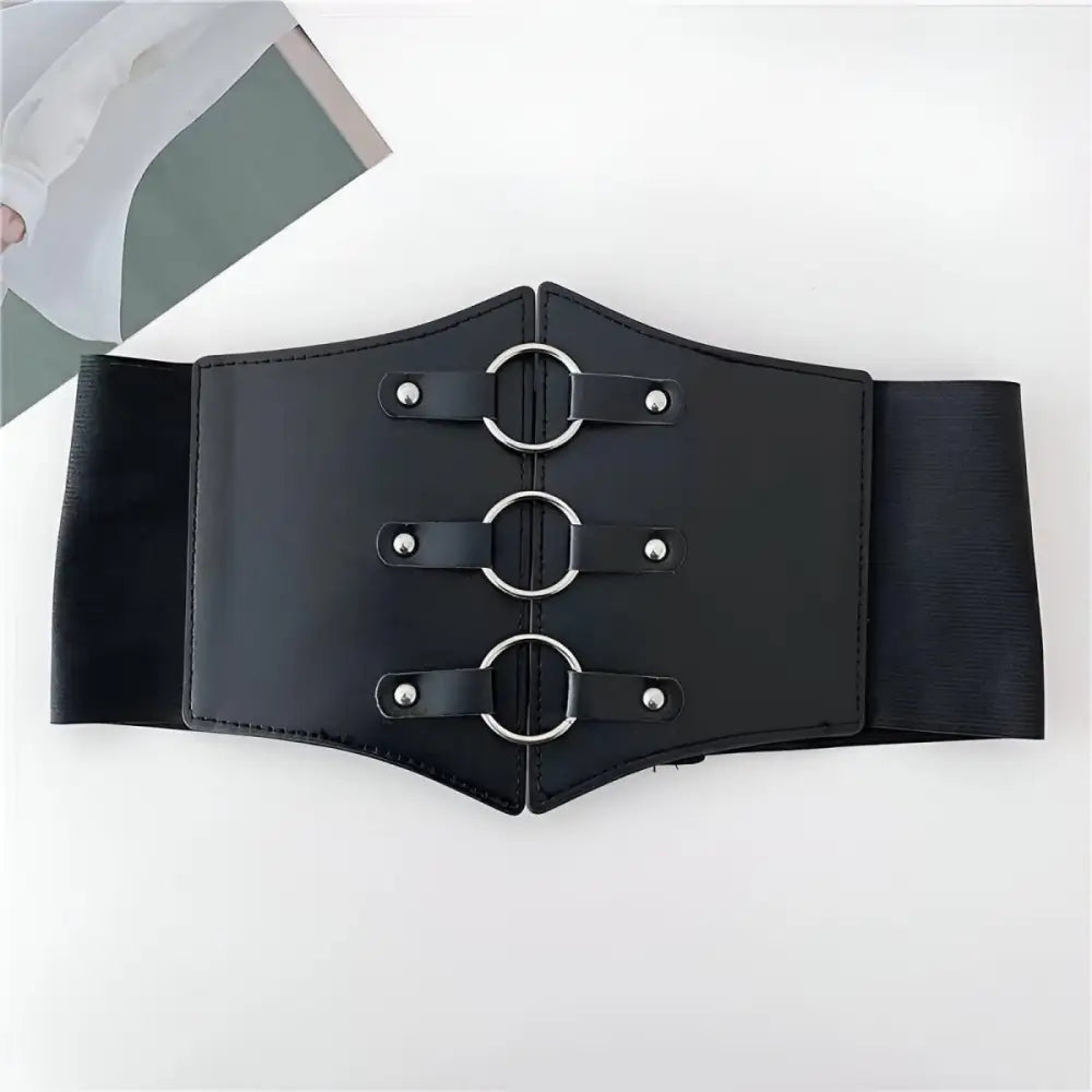 Black leather corset belt with metal rings, stylish and adjustable accessory for fashion