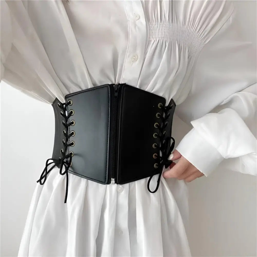 Black faux leather Lexy Corset Belt with zipper details on White Oversized Shirt