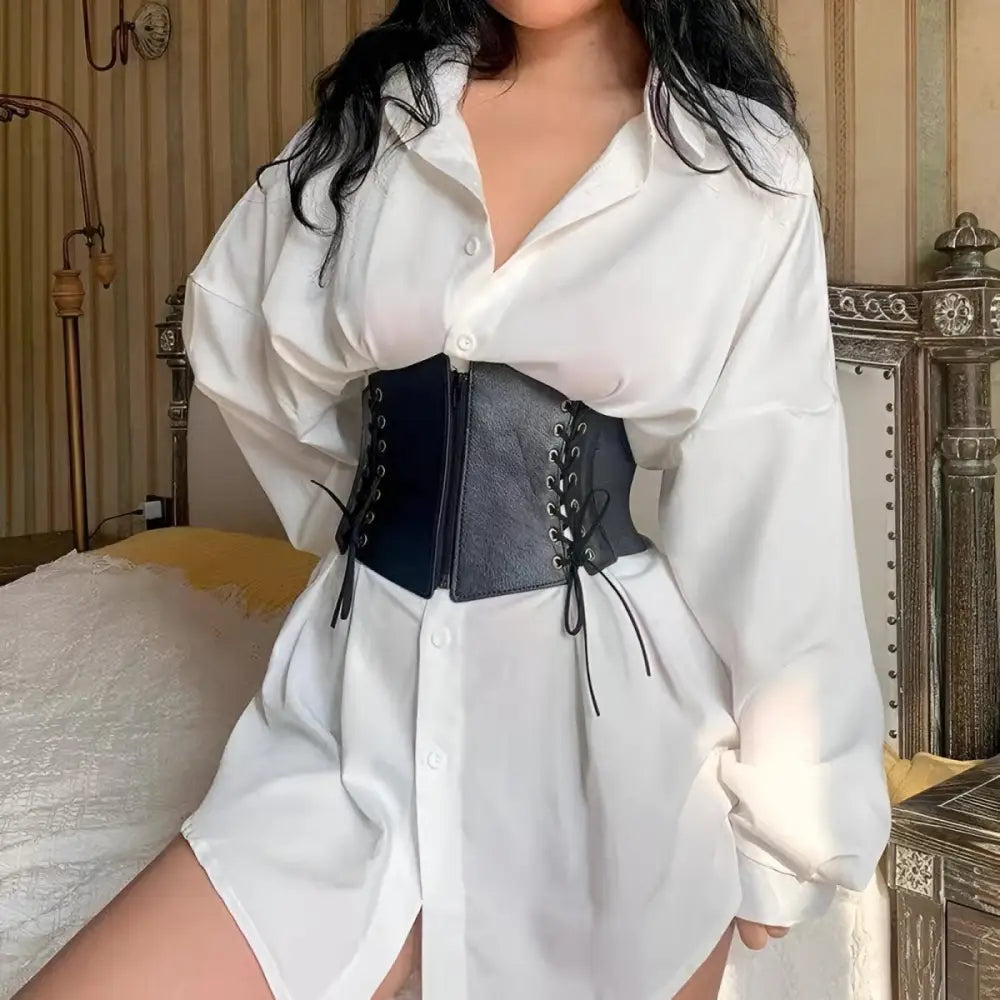 White oversized shirt with black Lexy corset belt and zipper details for a fashionable look
